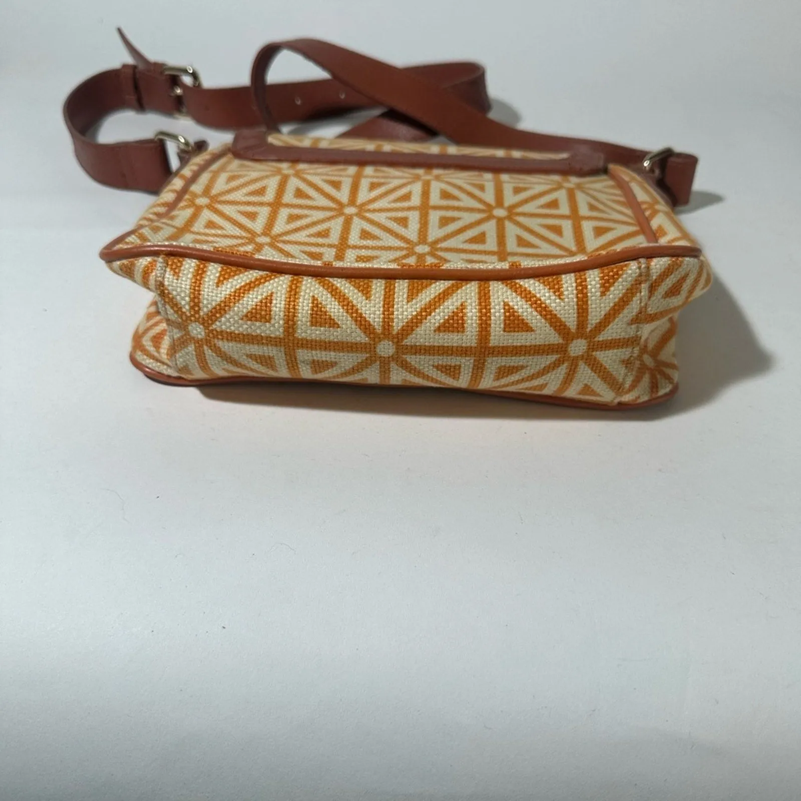 Orange and Cream Geometric Crossbody Bag with Flap Closure