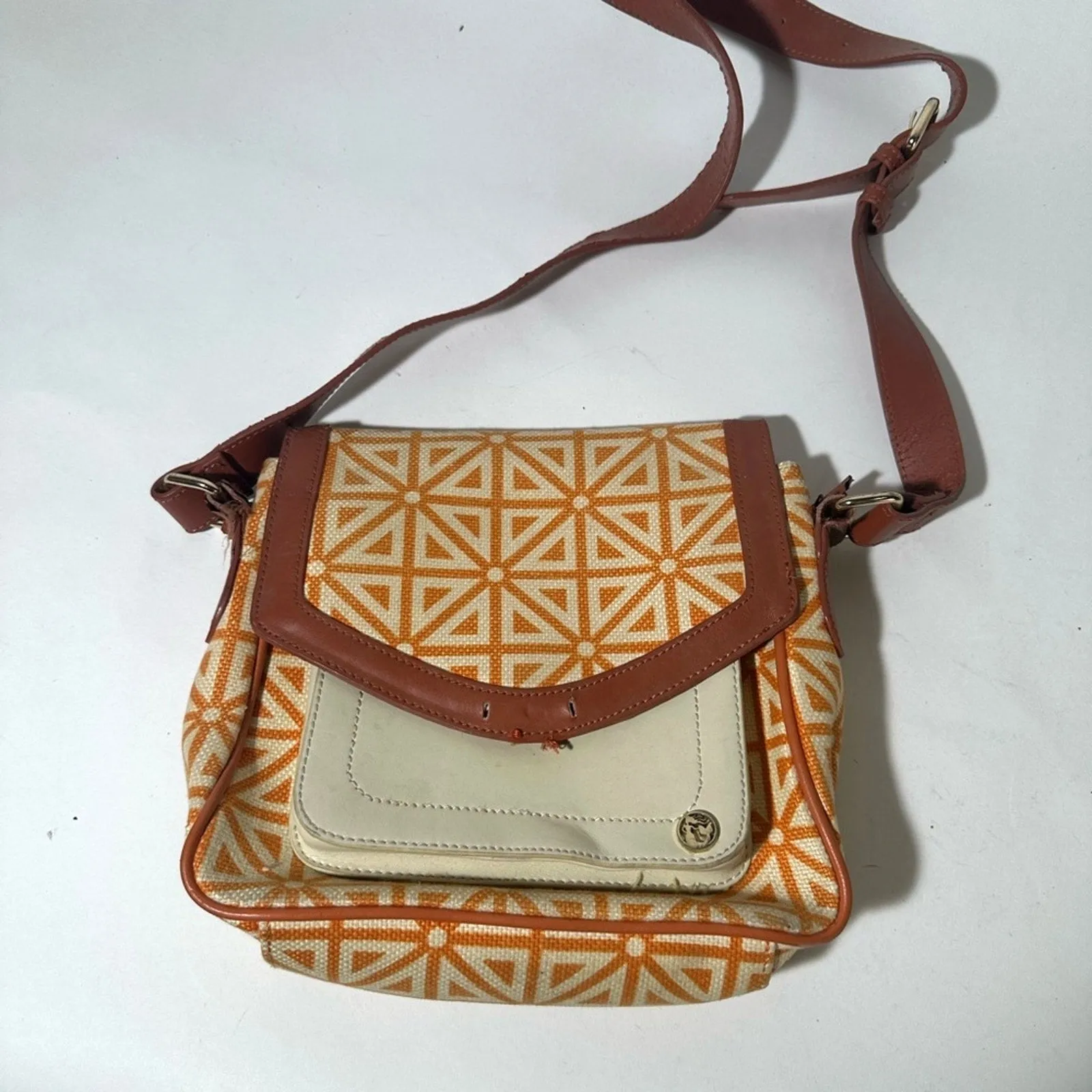 Orange and Cream Geometric Crossbody Bag with Flap Closure